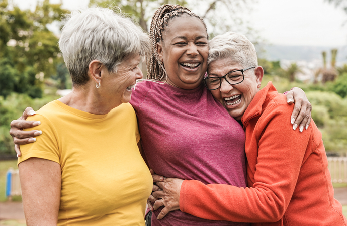 a group of seniors hug